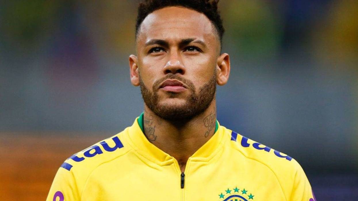Neymar Jr. of Brazil looks on during the national anthem before the friendly match against Qatar at Mane Garrincha Stadium on June 05, 2019 in Brasilia, Brazil.