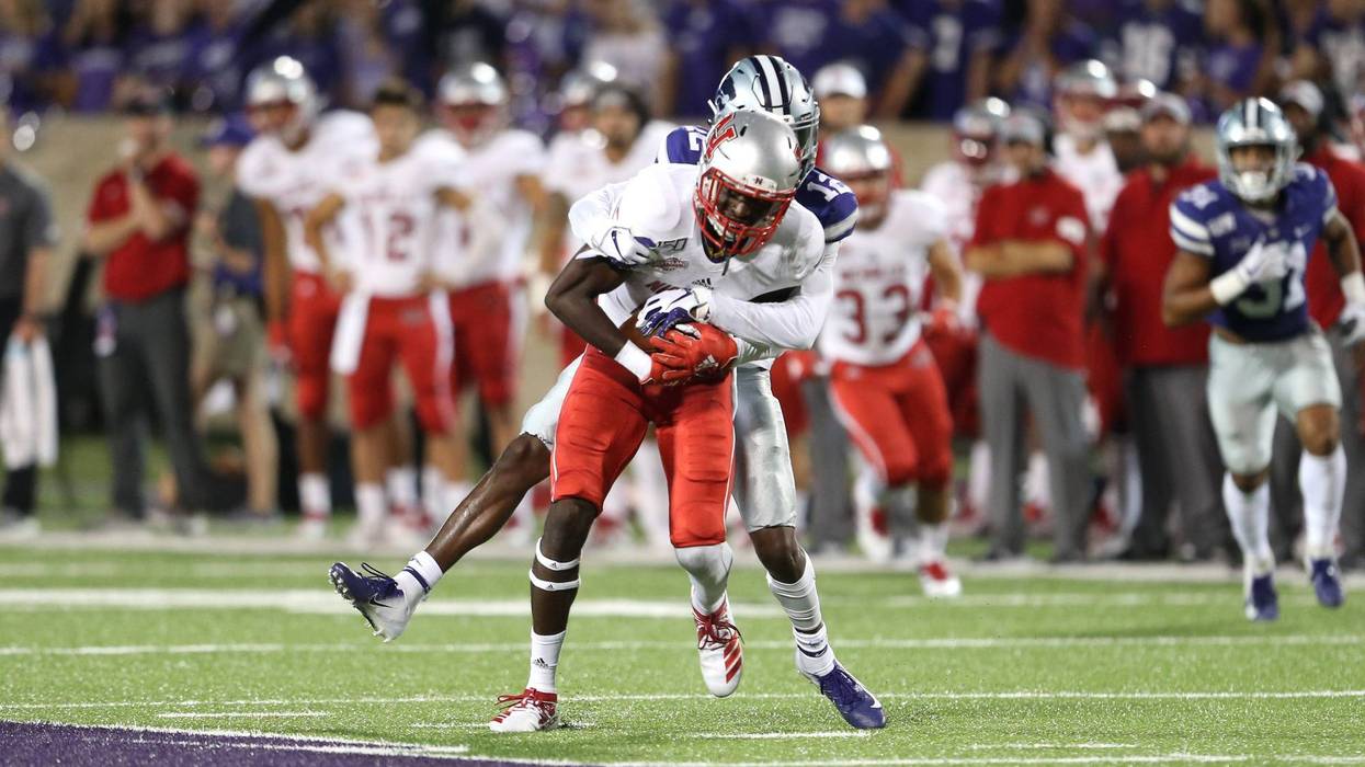 Nicholls State Colonels wide receiver Dai'Jean Dixon (5) is tackled by Kansas State Wildcats defensive back AJ Parker (12) during the fourth quarter at Bill Snyder Family Stadium.