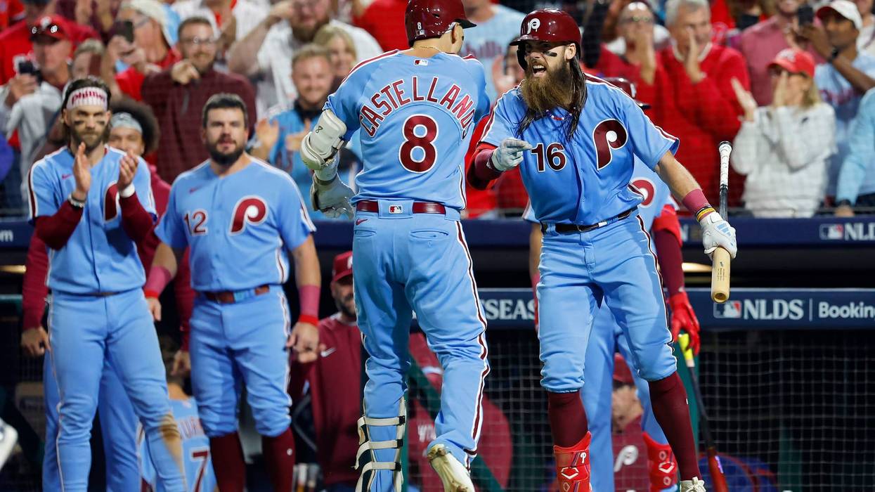 Nick Castellanos and Brandon Marsh of the Philadelphia Phillies celebrate after Castellanos hit a home run in the sixth inning against the Atlanta Braves in Game Four of the Division Series Thursday night.