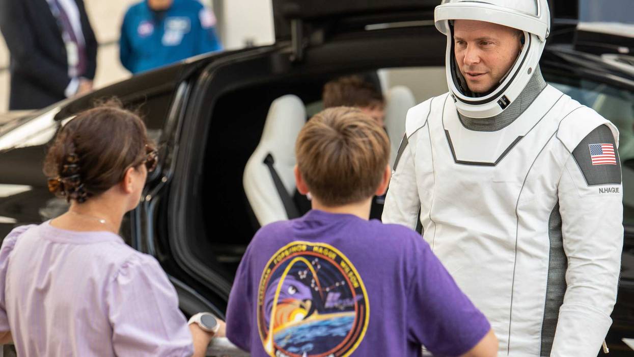 Nick Hague talks with his family minutes before heading to launch pad 40 at the Cape Canaveral Space Force Station. (