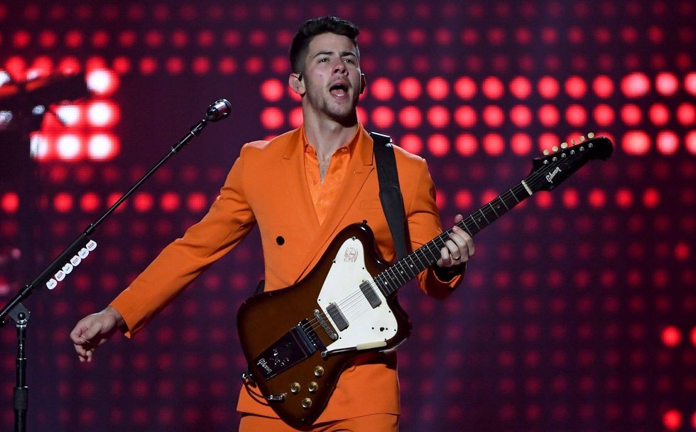 Imagine walking your dog in a Jonas Brothers shirt and getting stopped by Nick Jonas