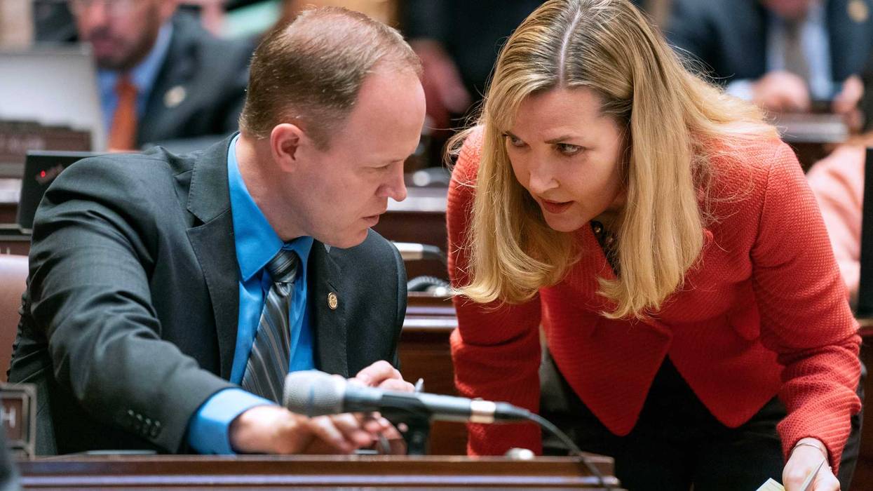 Nicole Mitchell discuss legislation during a floor session. Her lawyer has said she will resign her seat on August 4 after being convicted on burglary charges.