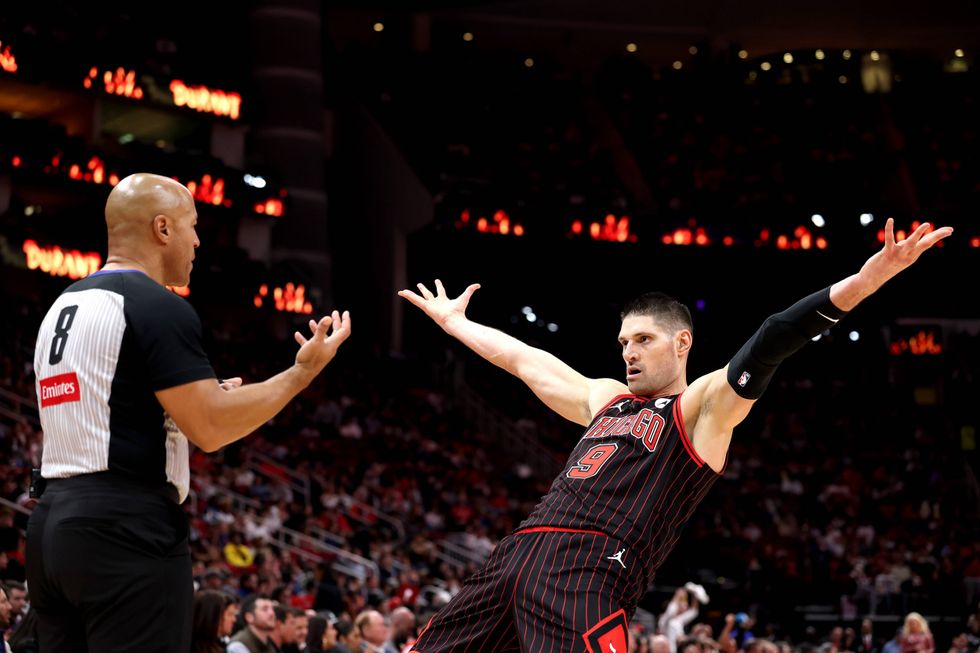 Nikola Vucevic #9 of the Chicago Bulls gestures toward referee Marc Davis #8 during the game at Toyota Center on January 13, 2026 in Houston, Texas.