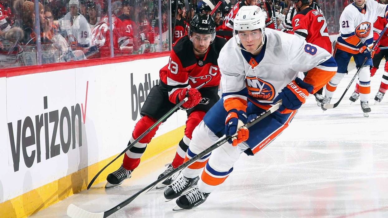 Noah Dobson skates away from a Devil