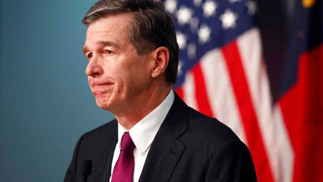 North Carolina Gov. Roy Cooper listens to a question during a briefing on the coronavirus pandemic at the Emergency Operations Center in Raleigh, N.C., Thursday, May 28, 2020.