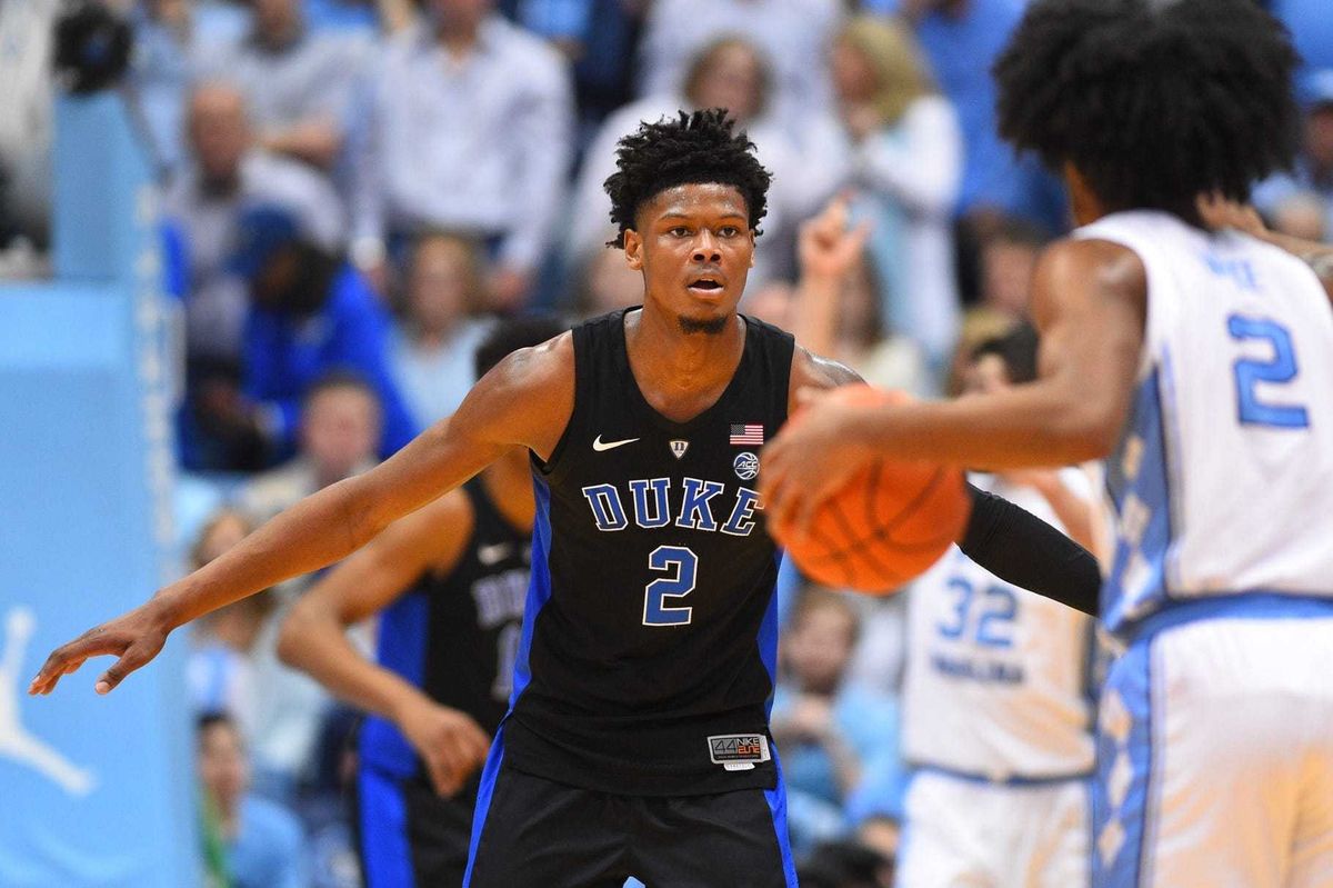 North Carolina Tar Heels guard Coby White (2) with the ball as Duke Blue Devils forward Cam Reddish (2) defends in the first half at Dean E. Smith Center.