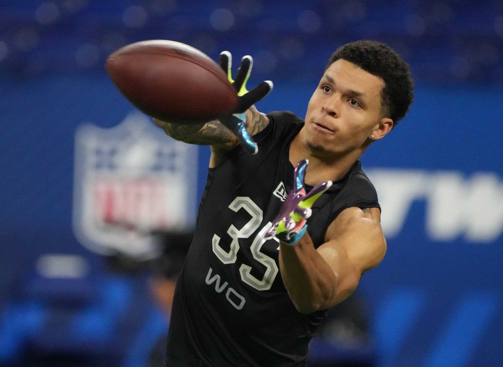 North Dakota State wide receiver Christian Watson (WO35) goes through drills during the 2022 NFL Scouting Combine at Lucas Oil Stadium.