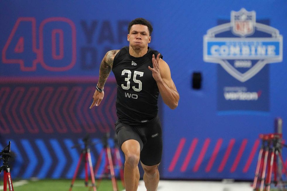 North Dakota State wide receiver Christian Watson (WO35) runs the 40-yard dash during the 2022 NFL Scouting Combine at Lucas Oil Stadium.