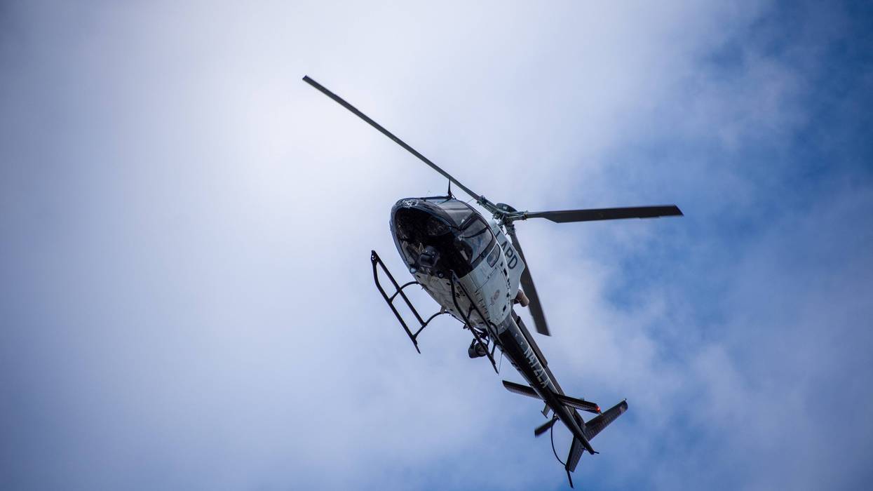 Northridge, CA / United States - May 27, 2019: LAPD Air Unit and Patrol Units respond to brandishing/ADW call in suburban neighborhood. Unit shown here is one of 10 American Eurocopter AS350 B2 A-Star helicopters the LAPD has in its fleet.