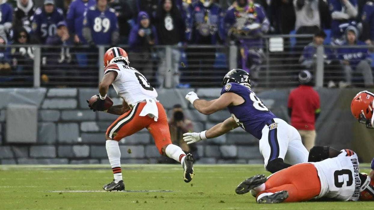 Nov 12, 2023; Baltimore, Maryland, USA; Cleveland Browns cornerback Greg Newsome II (0) returns a interception for a touchdown during the second half against the Baltimore Ravens at M&T Bank Stadium. Mandatory Credit: Tommy Gilligan-USA TODAY Sports