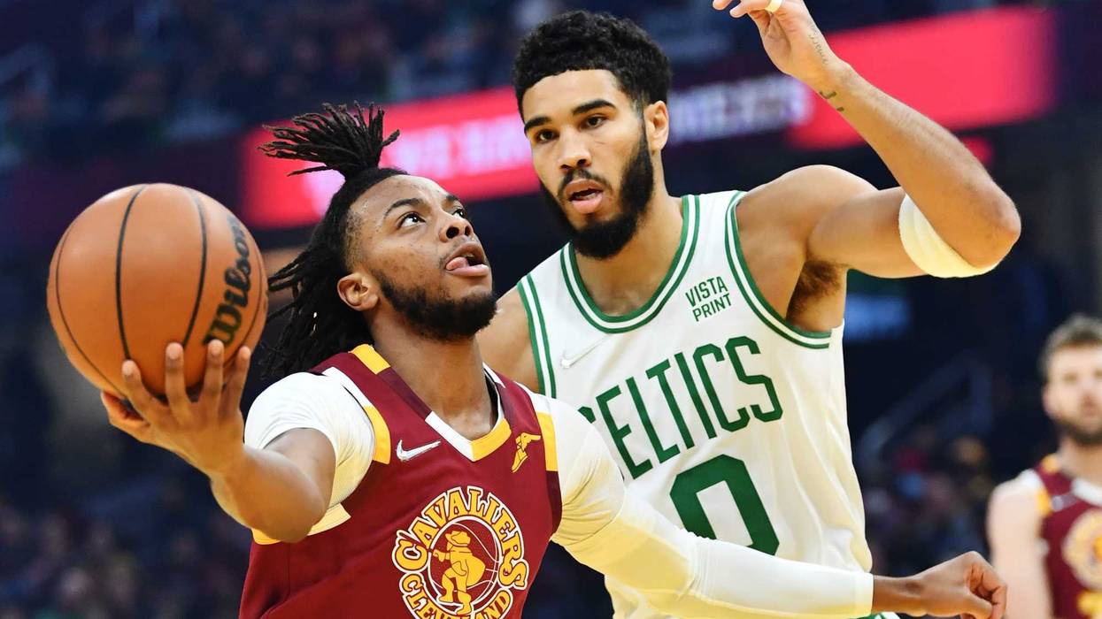 Nov 13, 2021; Cleveland, Ohio, USA; Cleveland Cavaliers guard Darius Garland (10) drives to the basket against Boston Celtics forward Jayson Tatum (0) during the first quarter at Rocket Mortgage FieldHouse.