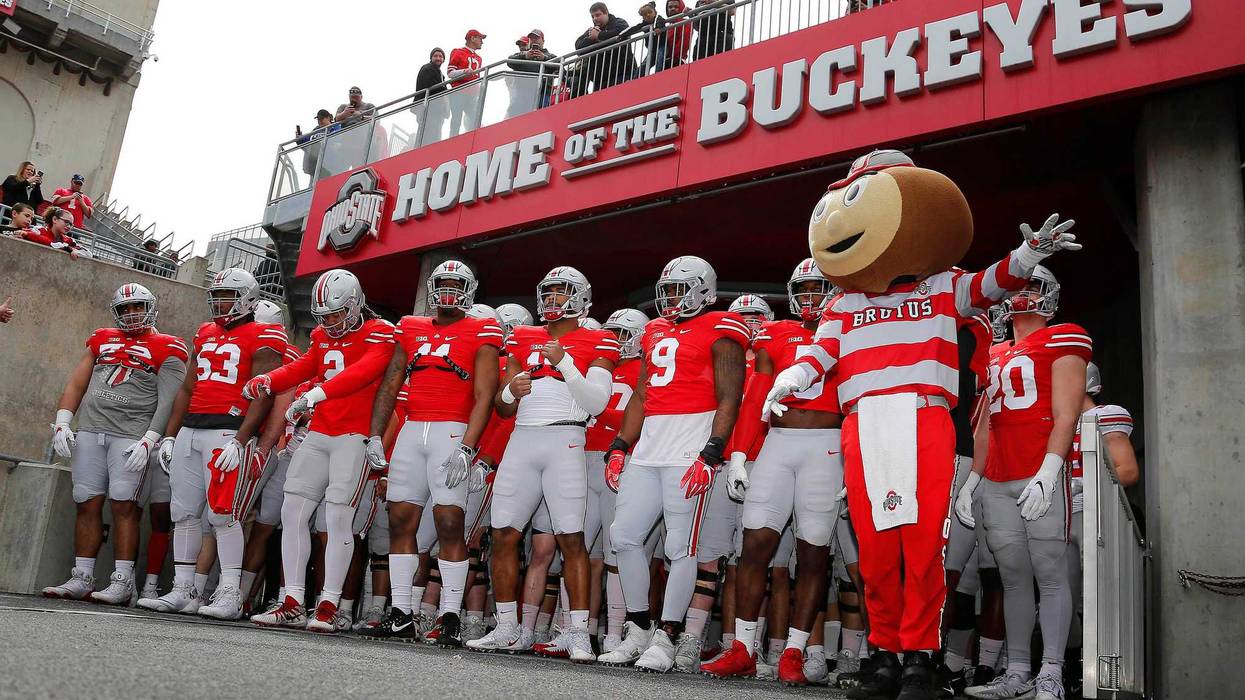 Nov 17, 2018; College Park, MD, USA; Ohio State Buckeyes quarterback Dwayne Haskins (7) dives for the game winning touchdown in overtime against the Maryland Terrapins at Capital One Field at Maryland Stadium. Mitch Stringer-USA TODAY Sports
