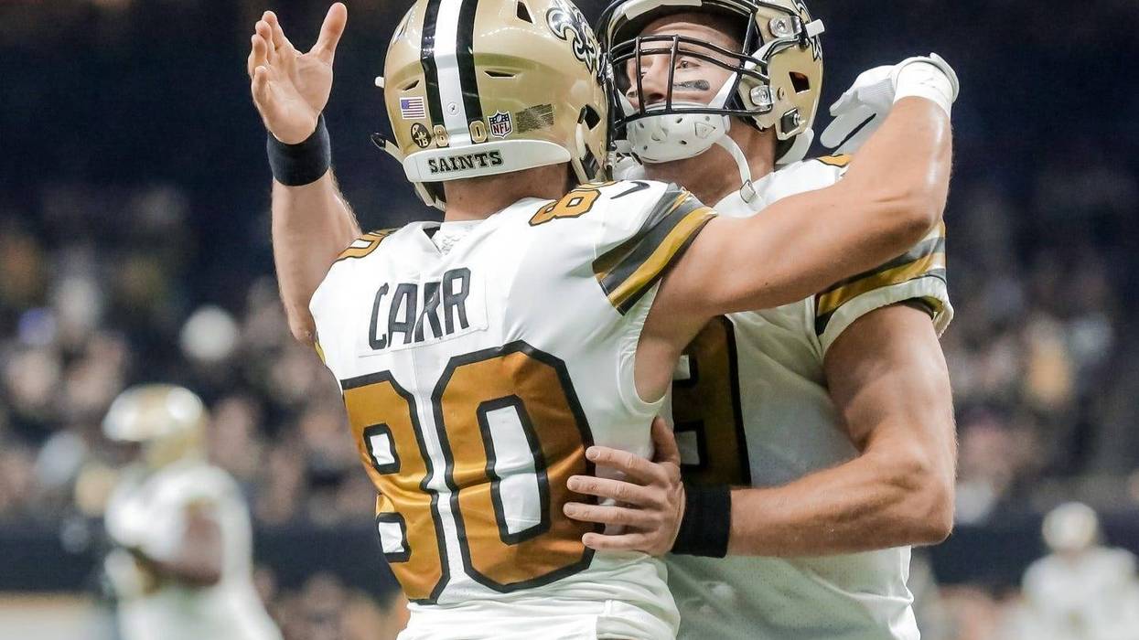 Nov 18, 2018; New Orleans, LA, USA; New Orleans Saints quarterback Drew Brees (9) celebrates with wide receiver Austin Carr (80) after a touchdown during the first quarter against the Philadelphia Eagles at the Mercedes-Benz Superdome.