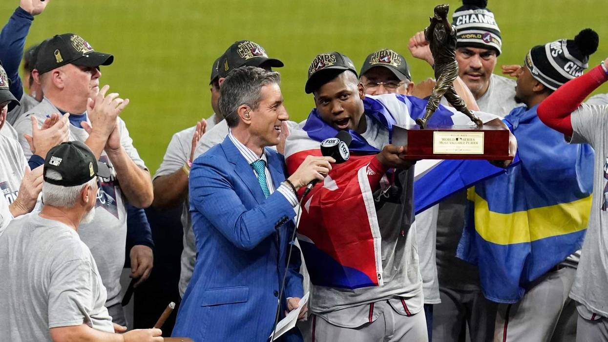 Nov 2, 2021; Houston, TX, USA; Atlanta Braves designated hitter Jorge Soler hoists the World Series MVP trophy after defeating the Houston Astros in game six of the 2021 World Series at Minute Maid Park. Mandatory Credit: Thomas Shea-USA TODAY Sports