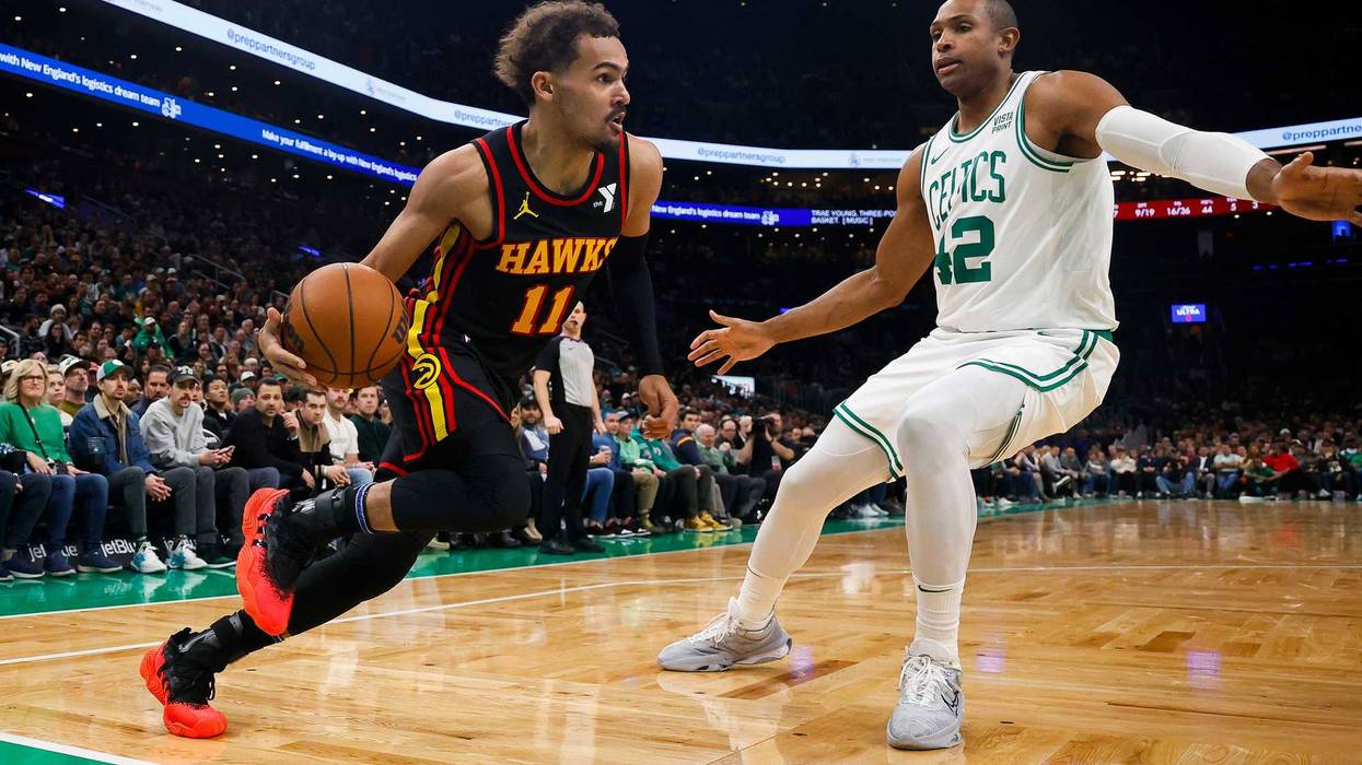 Nov 26, 2023; Boston, Massachusetts, USA; Atlanta Hawks guard Trae Young (11) dribbles on the baseline against Boston Celtics center Al Horford (42) during the second quarter at TD Garden. Mandatory Credit: Winslow Townson-USA TODAY Sports