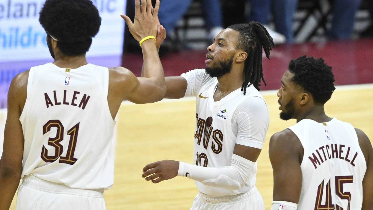Nov 26, 2023; Cleveland, Ohio, USA; Cleveland Cavaliers center Jarrett Allen (31), guard Darius Garland (10), and guard Donovan Mitchell (45) celebrate in the fourth quarter against the Toronto Raptors at Rocket Mortgage FieldHouse.