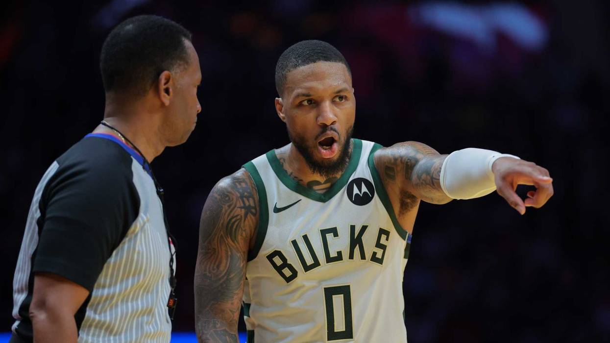 Nov 26, 2024; Miami, Florida, USA; Milwaukee Bucks guard Damian Lillard (0) talks to referee James Capers (19) during the third quarter at Kaseya Center. Mandatory Credit: Sam Navarro-Imagn Images