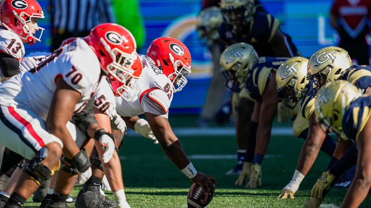 Nov 27, 2021; Atlanta, Georgia, USA; Georgia Bulldogs and Georgia Tech Yellow Jackets players await the snap during the second half at Bobby Dodd Stadium.