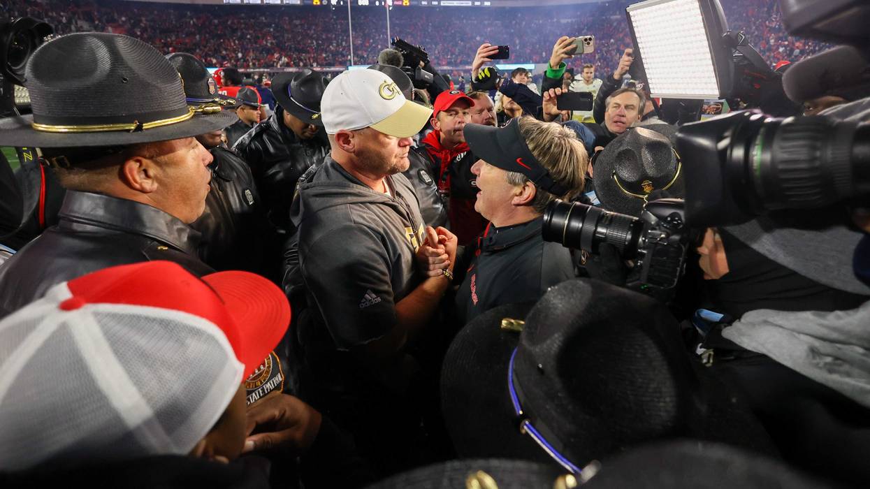Nov 29, 2024; Athens, Georgia, USA; Georgia Tech Yellow Jackets head coach Brent Key talks to Georgia Bulldogs head coach Kirby Smart after an eight overtime game at Sanford Stadium. Mandatory Credit: Brett Davis-Imagn Images