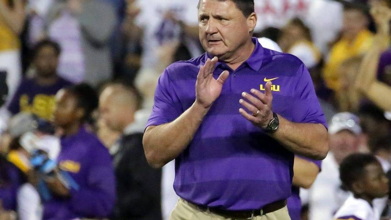 Nov 3, 2018; Baton Rouge, LA, USA; LSU Tigers head coach Ed Orgeron cheers on his players during warmup drills before their game against the Alabama Crimson Tide at Tiger Stadium.