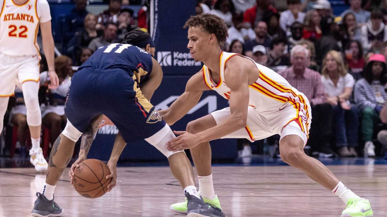 Nov 3, 2024; New Orleans, Louisiana, USA; Atlanta Hawks guard Dyson Daniels (5) attempts to steal the ball from New Orleans Pelicans guard Brandon Boston Jr. (11) during the first half at Smoothie King Center. Mandatory Credit: Stephen Lew-Imagn Images