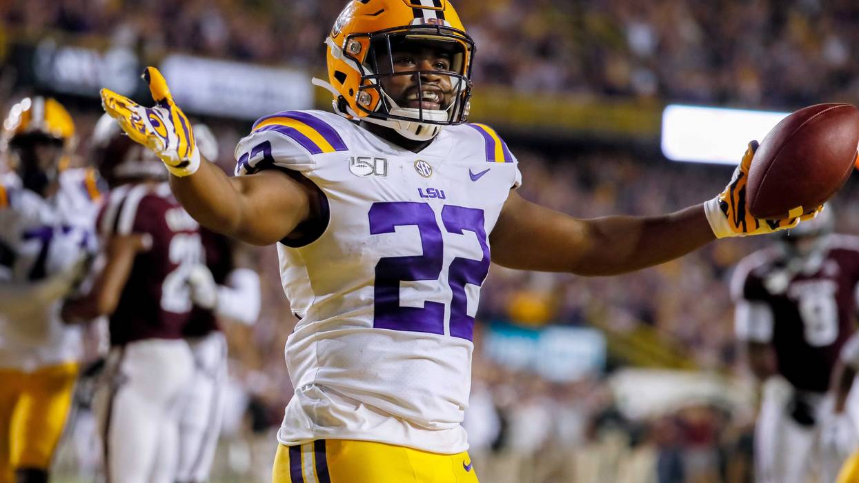 Nov 30, 2019; Baton Rouge, LA, USA; LSU Tigers running back Clyde Edwards-Helaire (22) reacts after scoring on a five yard touchdown against the Texas A&M Aggies during the first quarter at Tiger Stadium. Mandatory Credit: Stephen Lew-USA TODAY Sports