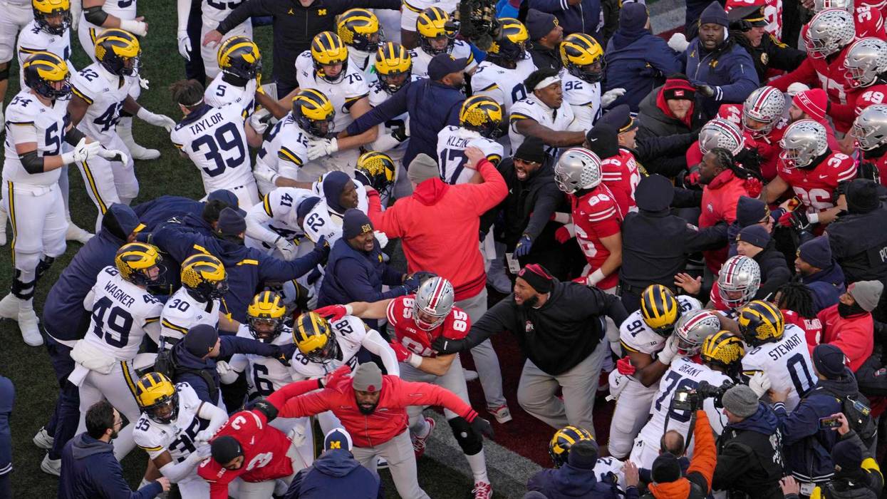 Nov 30, 2024; Columbus, Ohio, USA; Michigan Wolverines and Ohio State Buckeyes fight following the NCAA football game at Ohio Stadium in Columbus on Saturday, Nov. 30, 2024. Michigan won 13-10.