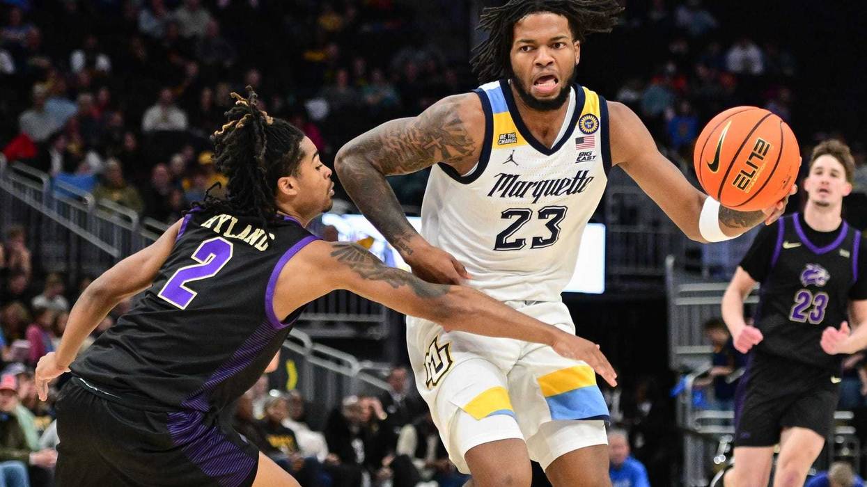 Nov 30, 2024; Milwaukee, Wisconsin, USA; Marquette Golden Eagles forward David Joplin (23) drives for the basket against Western Carolina Catamounts guard CJ Hyland (2) in the second half at Fiserv Forum. Mandatory Credit: Benny Sieu-Imagn Images