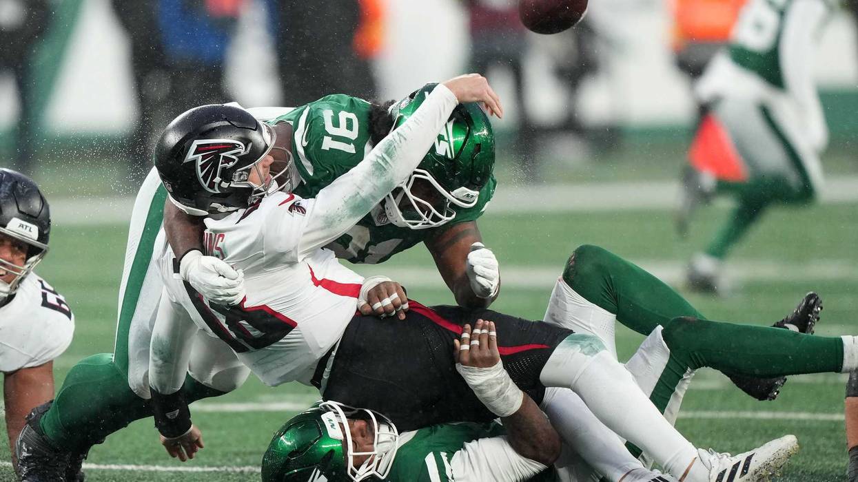 Nov 30, 2025; East Rutherford, New Jersey, USA; New York Jets defensive tackle Jowon Briggs (91) pressures Atlanta Falcons quarterback Kirk Cousins (18) during the second half at MetLife Stadium. Mandatory Credit: Robert Deutsch-Imagn Images
