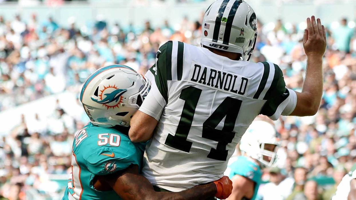 Nov 4, 2018; Miami Gardens, FL, USA; Miami Dolphins defensive end Andre Branch (50) hits New York Jets quarterback Sam Darnold (14) during the first half at Hard Rock Stadium. Mandatory Credit: Steve Mitchell-USA TODAY Sports