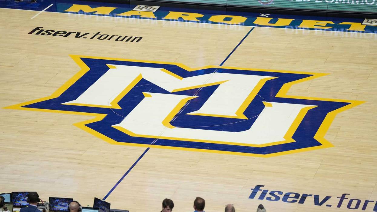 Nov 4, 2024; Milwaukee, Wisconsin, USA; General view of the Marquette Golden Eagles logo at center court during the game against the Stony Brook Seawolves at Fiserv Forum. Mandatory Credit: Jeff Hanisch-Imagn Images