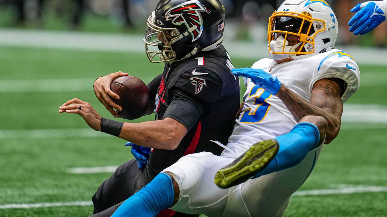 Nov 6, 2022; Atlanta, Georgia, USA; Los Angeles Chargers safety Derwin James Jr. (3) sacks Atlanta Falcons quarterback Marcus Mariota (1) during the first half at Mercedes-Benz Stadium.