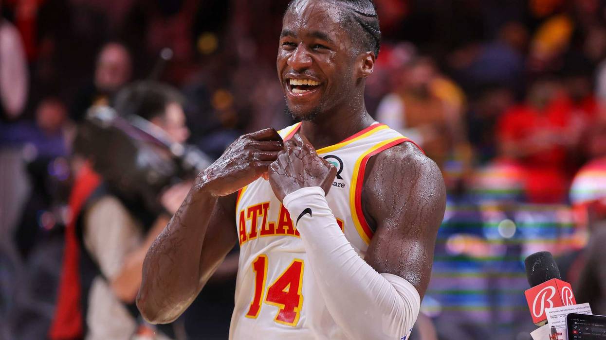 Nov 7, 2022; Atlanta, Georgia, USA; Atlanta Hawks forward AJ Griffin (14) celebrates after a victory against the Milwaukee Bucks at State Farm Arena.
