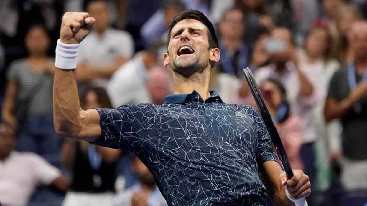 Novak Djokovic celebrates match point against Kei Nishikori in the U.S. Open semifinals at the USTA Billie Jean King National Tennis Center.
