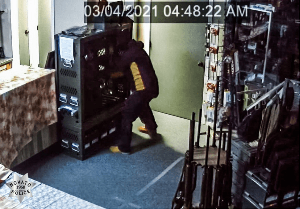 Novato Police said the suspect, who fled the scene on foot, left his green 1997 Honda Civic wedged inside the store.