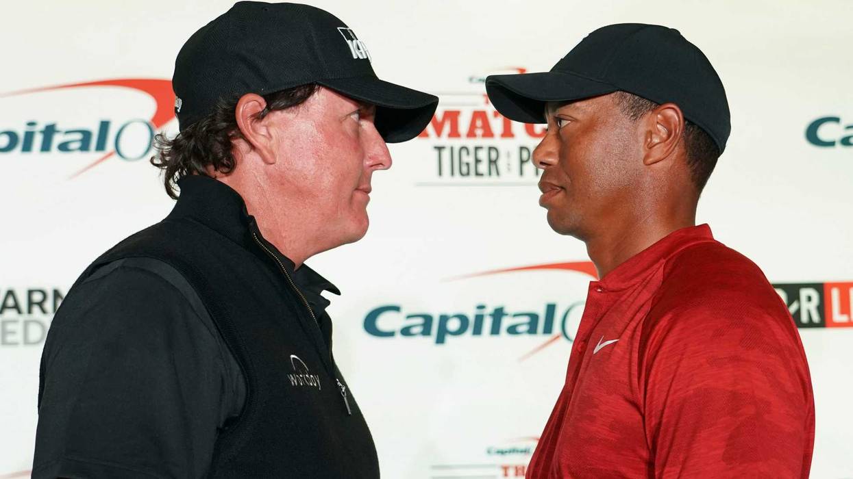 November 20, 2018; Las Vegas, NV, USA; Phil Mickelson (left) and Tiger Woods (right) pose for a photo during a press conference before The Match: Tiger vs Phil golf match at Shadow Creek Golf Course. Mandatory Credit: Kyle Terada-USA TODAY Sports