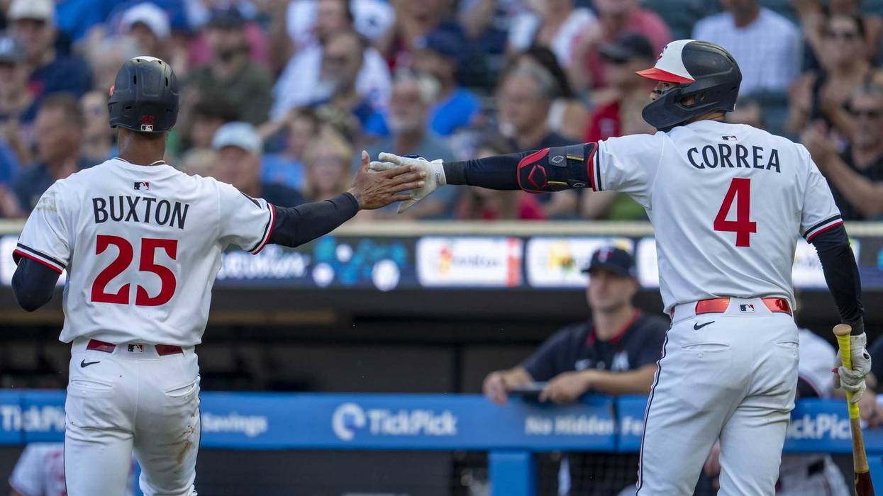 Now former Minnesota Twins teammates, center fielder Byron Buxton (25) shakes hands with shortstop Carlos Correa (4). With Correa gone, will the Twins look for other ways to trim payroll in the offseason, and could that include Buxton?