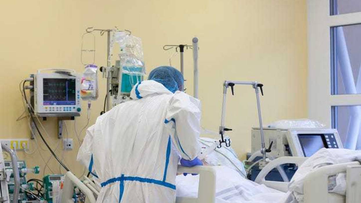 Nurse helping a patient who is ill.