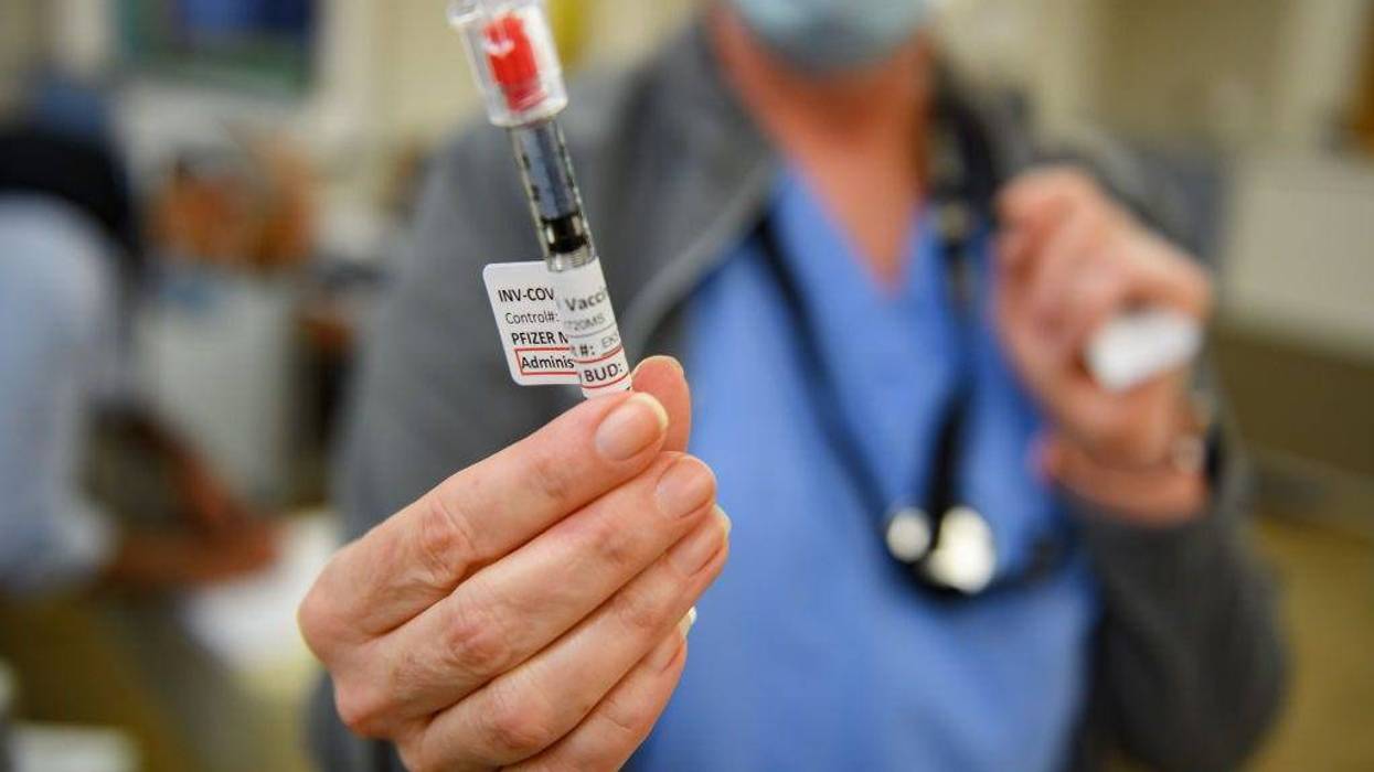 Nurse Mary Catherine Klee holds a dose of the Pzifer COVID-19 vaccine before administering it to an employee of the Pittsburgh VA Medical Center on December 17, 2020 in Pittsburgh, Pennsylvania.