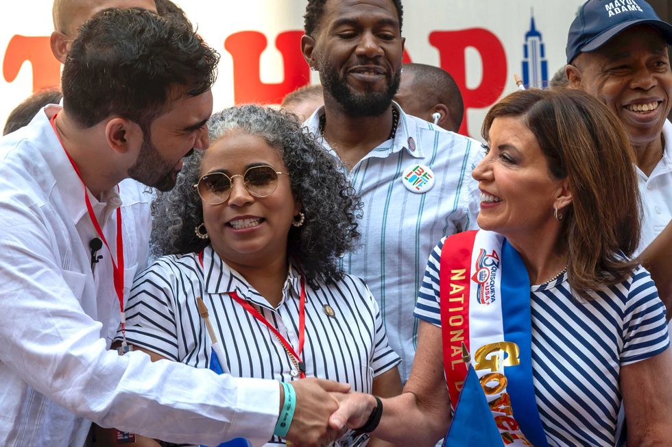 NYC mayoral candidate Zohran Mamdani shakes hands with Gov. Kathy Hochul during the Dominican Day Parade on Sixth Avenue on Aug. 10, 2025
