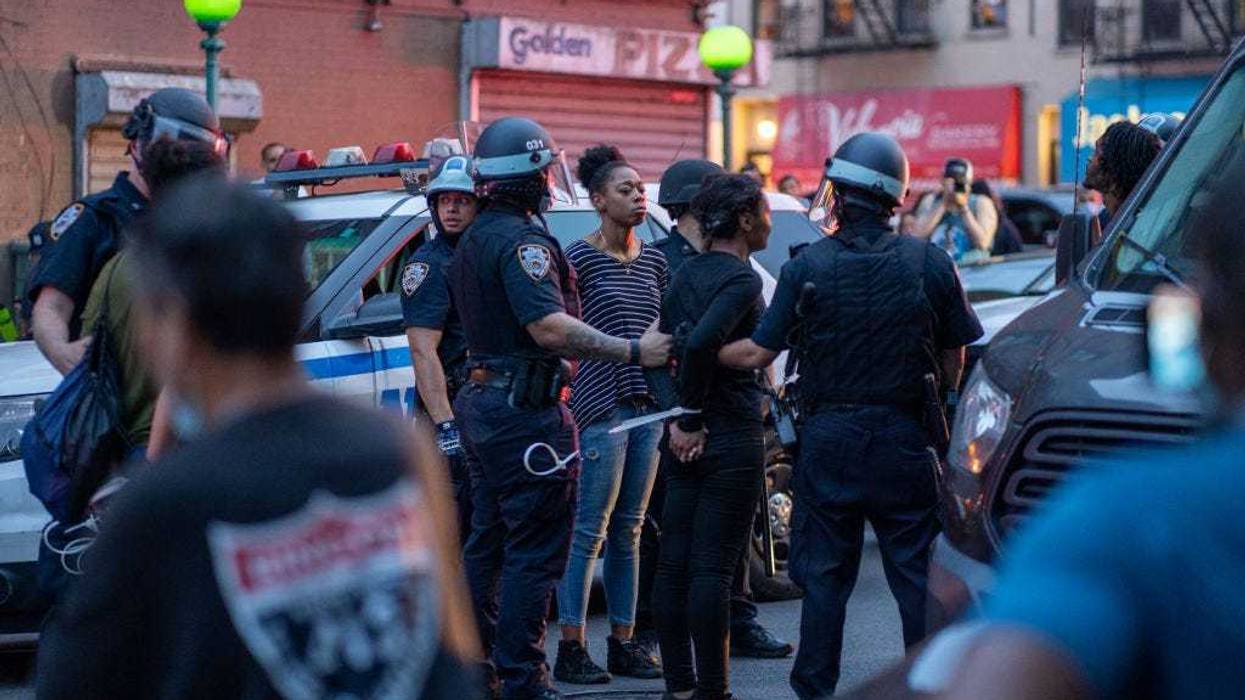 NYPD arrest protesters for breaking the citywide 8:00PM curfew on June 4, 2020, in the Bronx borough of New York City.
