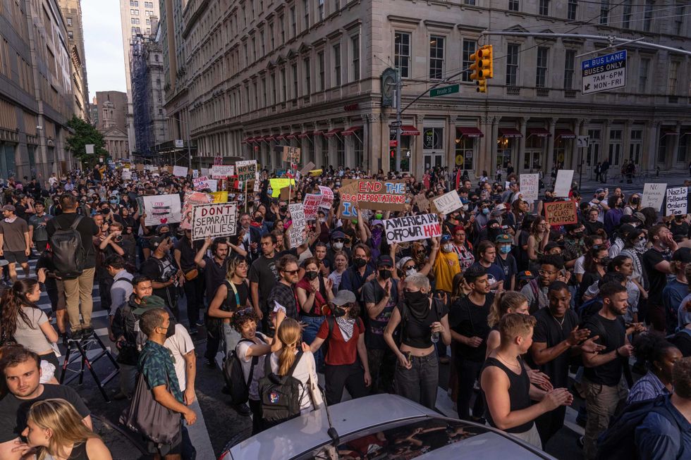 NYPD officers arrest a demonstrator during an anti-ICE protest outside 26 Federal Plaza Building on June 10, 2025