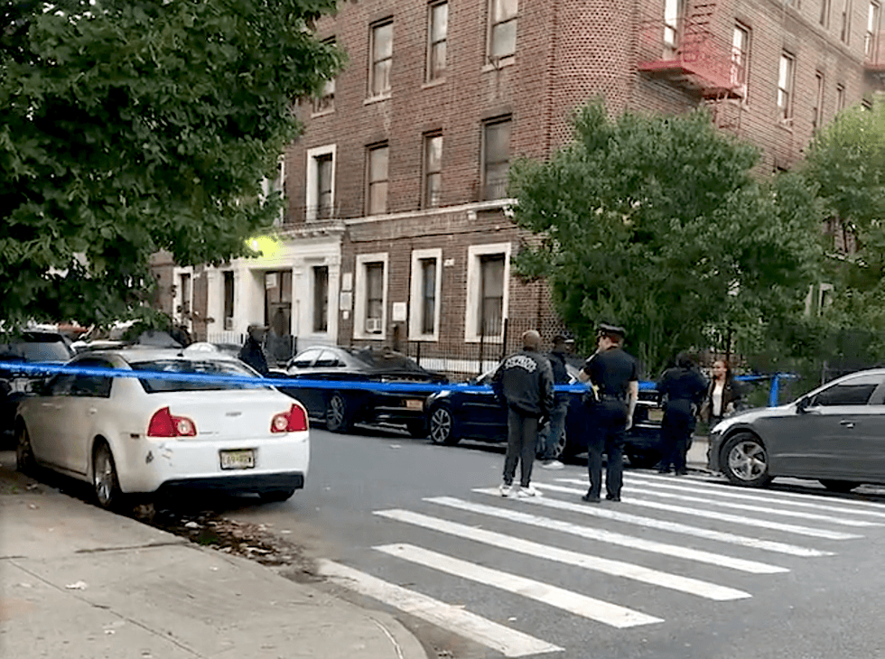 NYPD officers at the scene in Flatbush where a man was fatally shot and a teen girl was shot and wounded Sunday evening