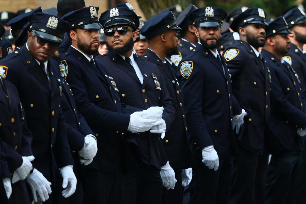 NYPD officers await the start of the funeral of slain NYPD officer Didarul Islam at Parkchester Jame Masjid on July 31, 2025