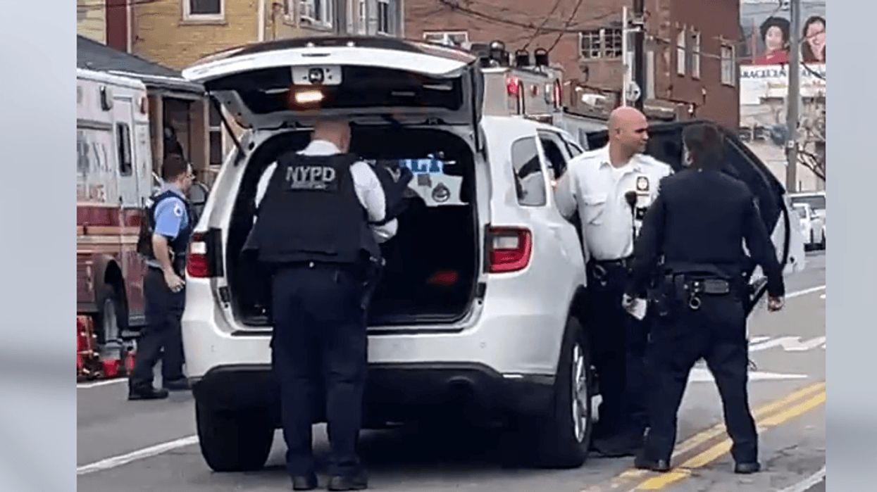 NYPD officers gathered outside the barricaded man's apartment Thursday morning.
