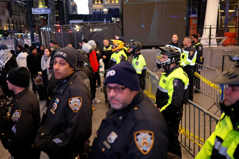 NYPD officers guard an entrance to Penn Station during a pro-Palestinian protest on Dec. 18, 2023