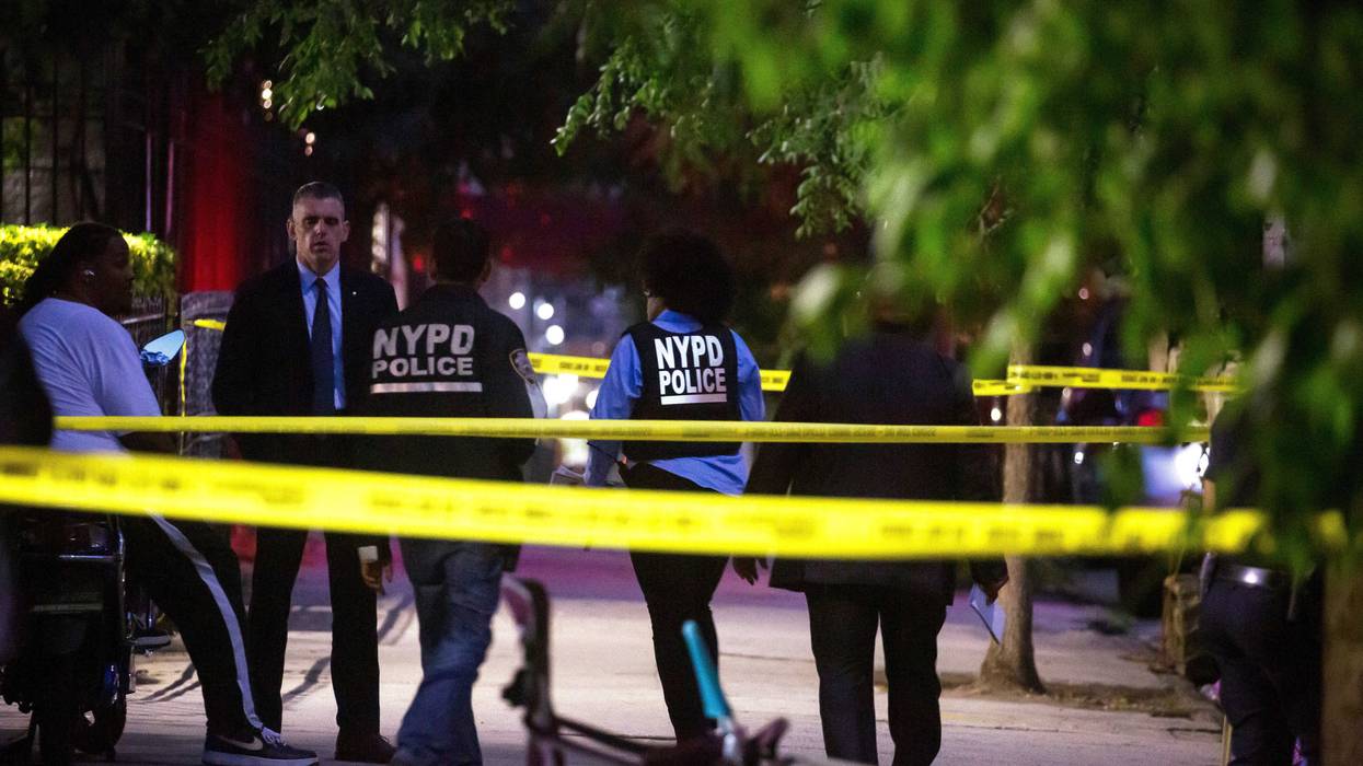 NYPD officers investigate the scene of a shooting in the Crown Heights neighborhood in Brooklyn on July 21, 2022