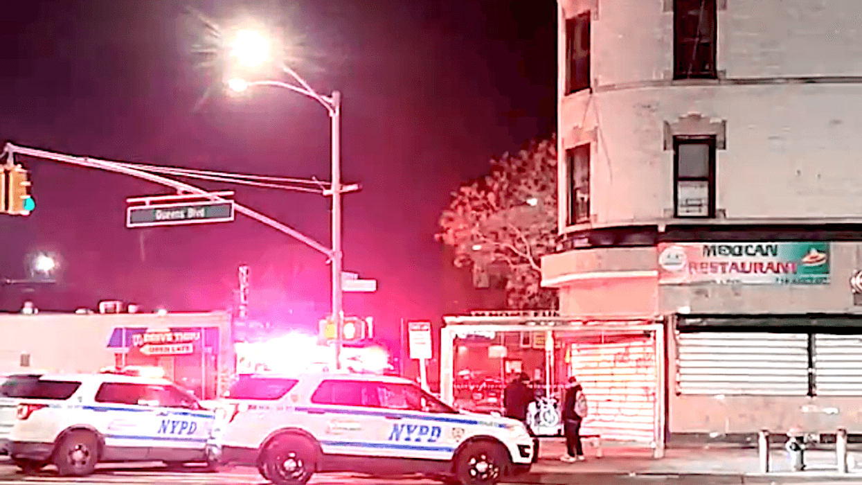 NYPD officers outside the Jamaica-Van Wyck station in Kew Gardens after a man was stabbed during an attempted robbery there Saturday morning