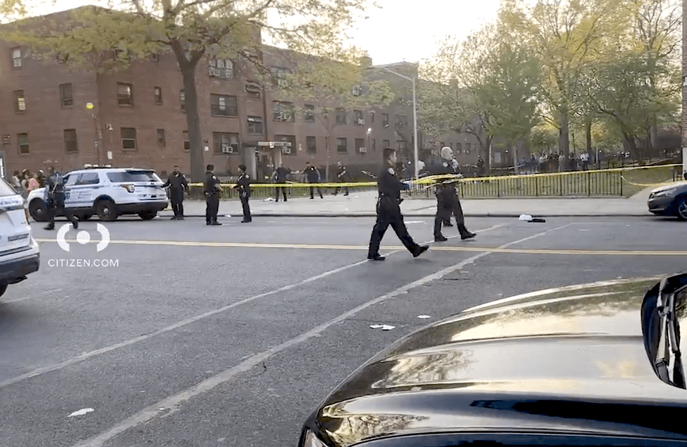 NYPD officers put up crime scene tape at the shooting scene in Throggs Neck