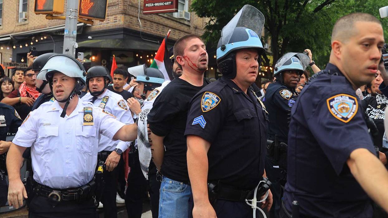NYPD officers restrain pro-Palestinian protesters during a Nakba Day demonstration in Bay Ridge on May 18, 2024